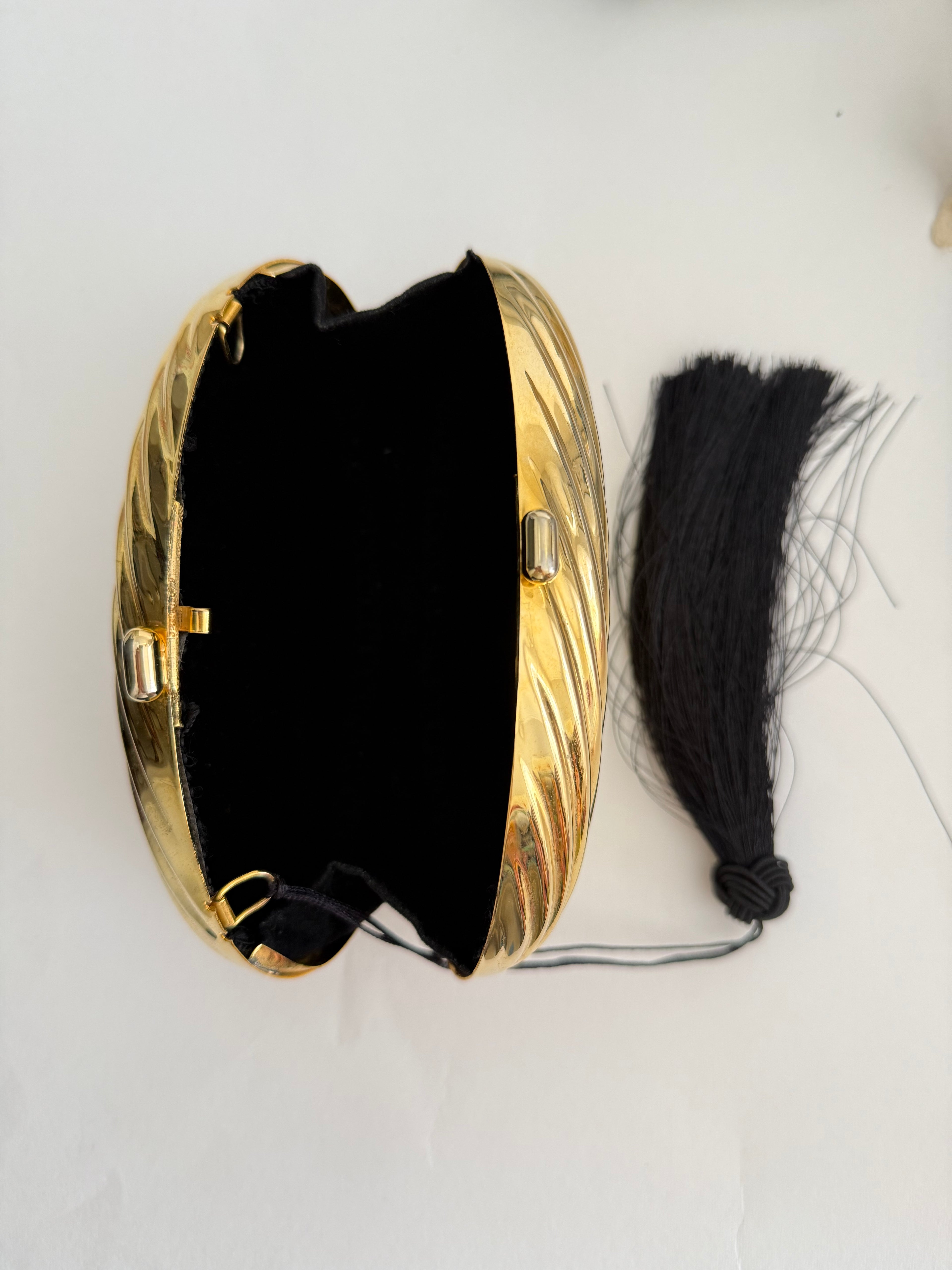 Gold clutch egg tassel