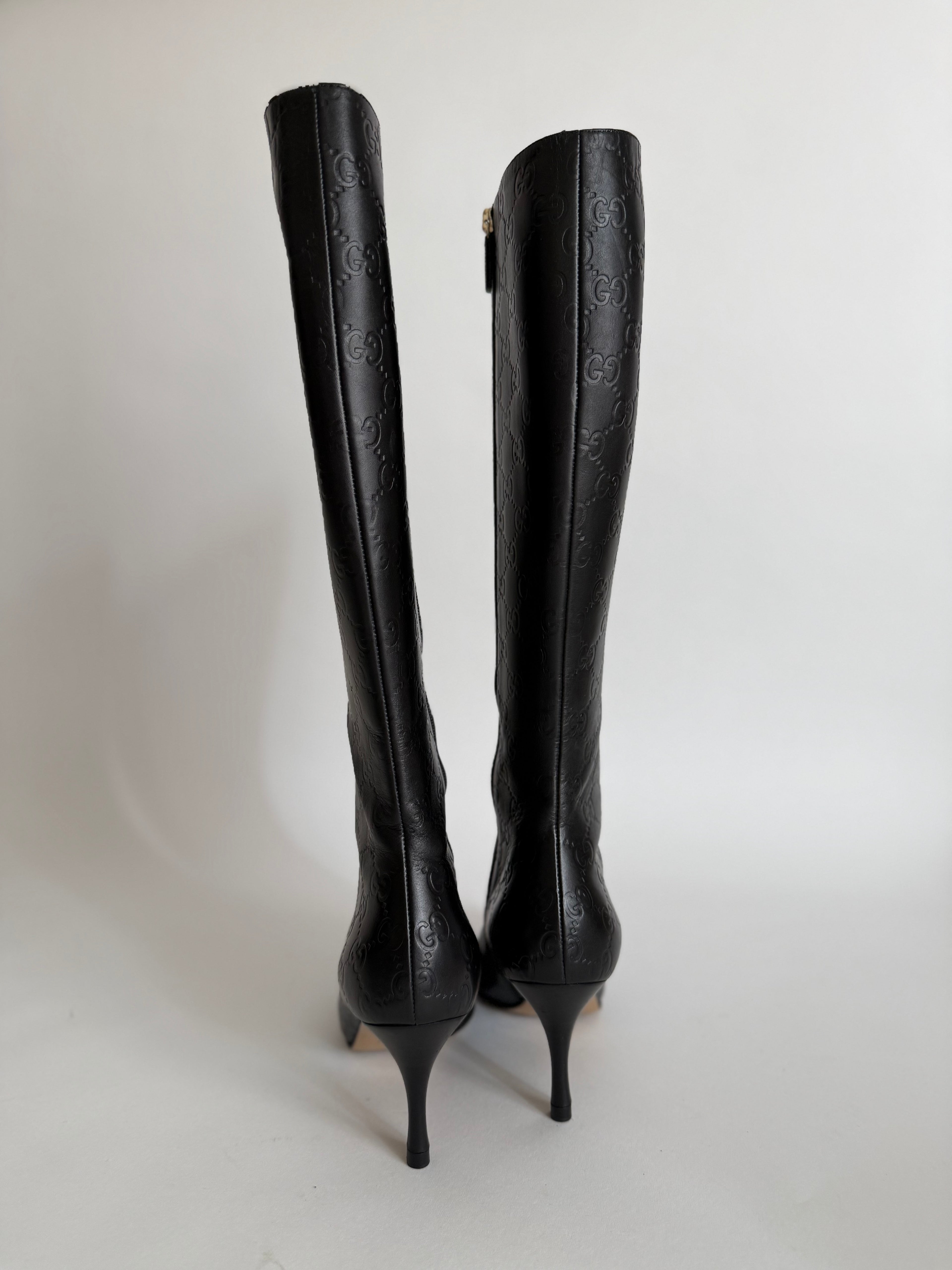 Gucci monogram leather boots