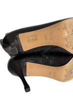 Gucci monogram leather boots