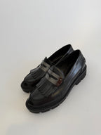 Black fringe moccasin