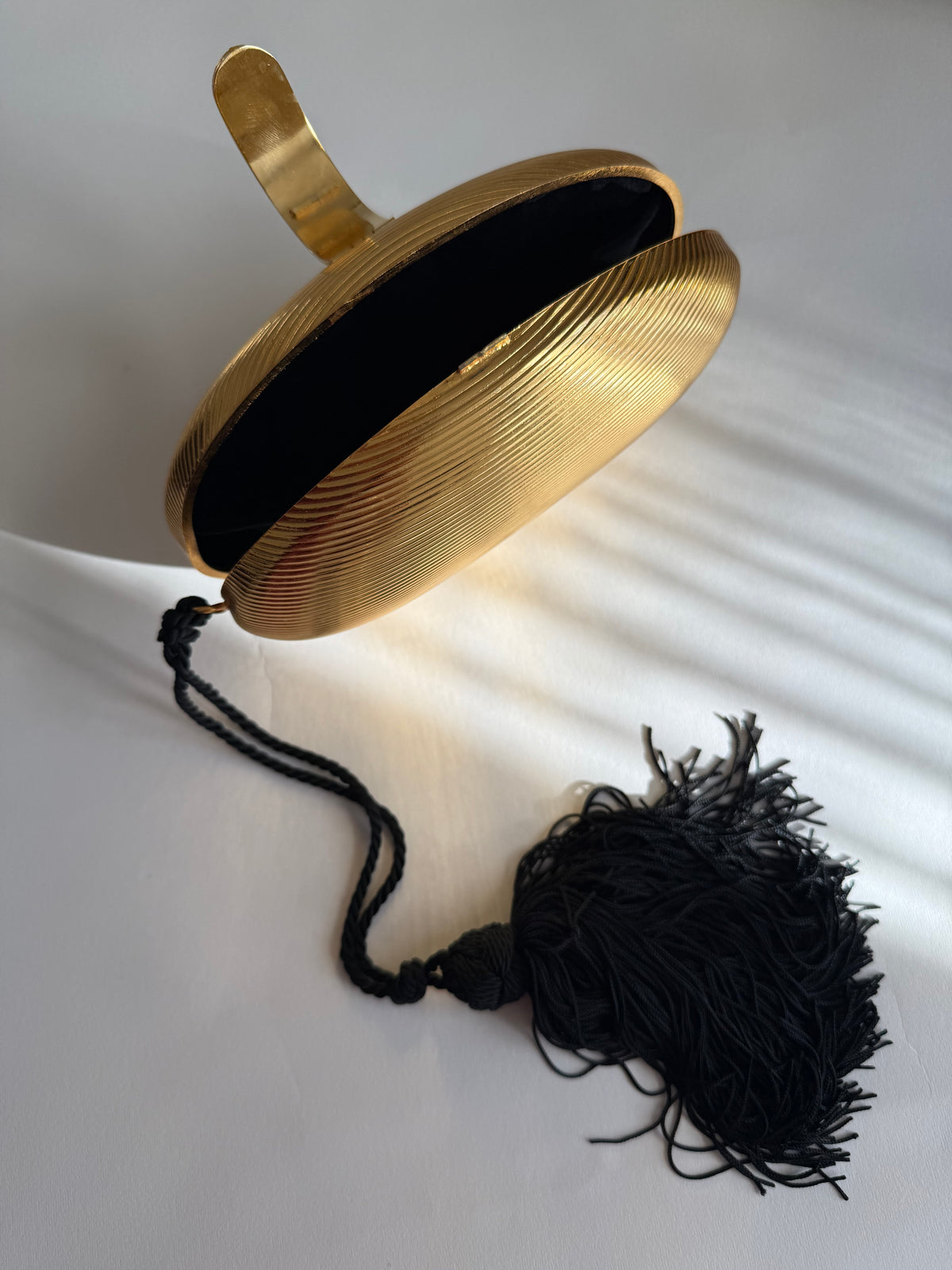 Gold egg shape metal clutch vintage with tassel
