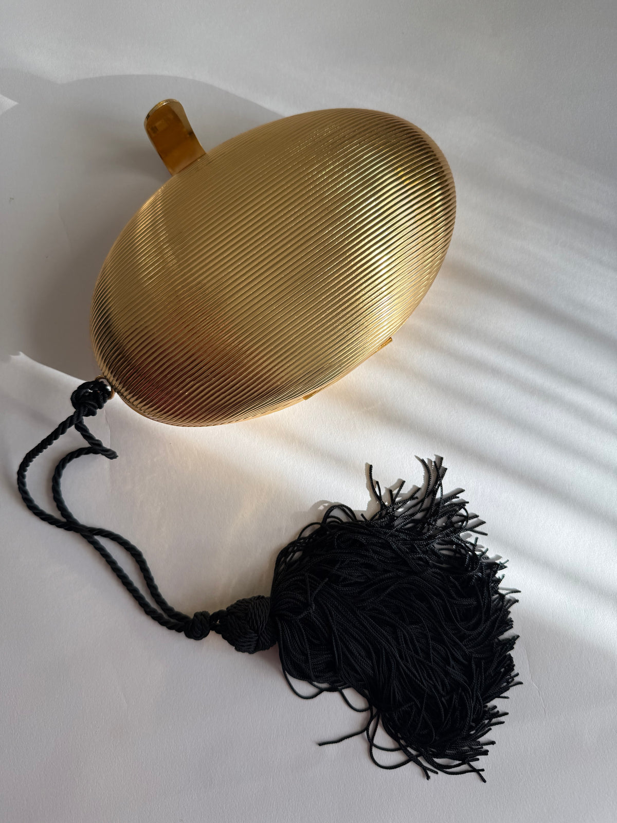 Gold egg shape metal clutch vintage with tassel