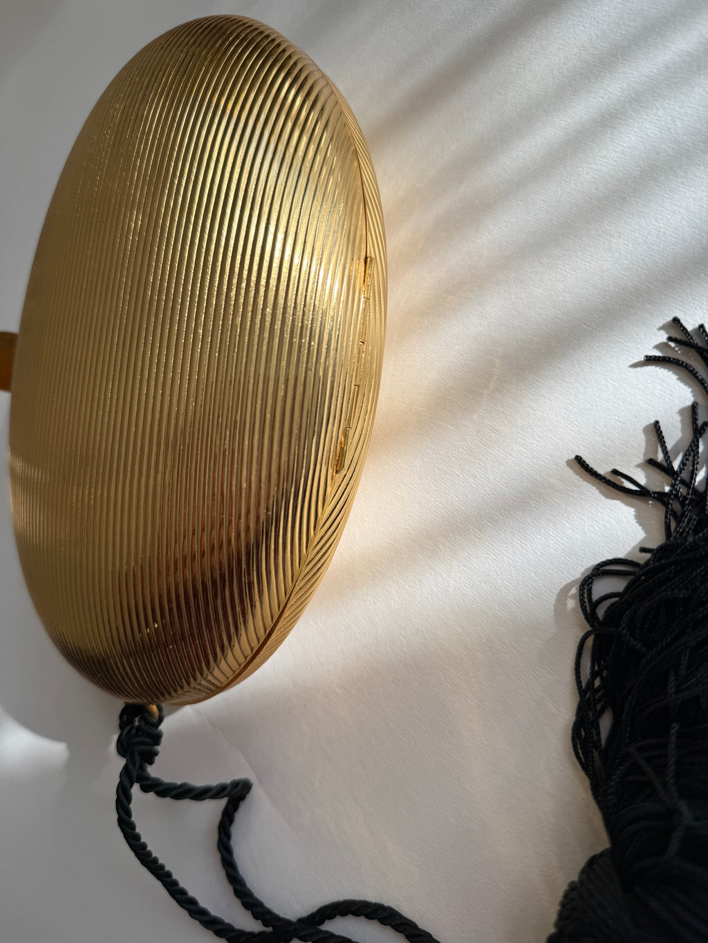 Gold egg shape metal clutch vintage with tassel