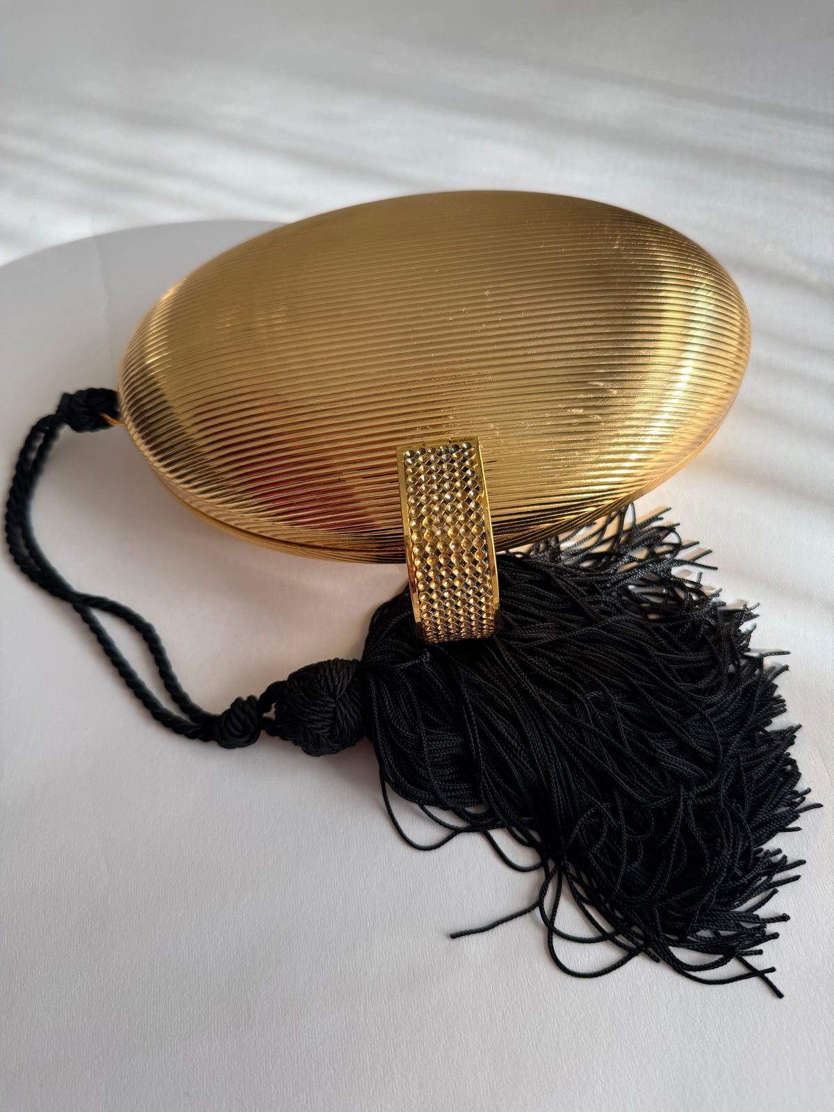 Gold egg shape metal clutch vintage with tassel