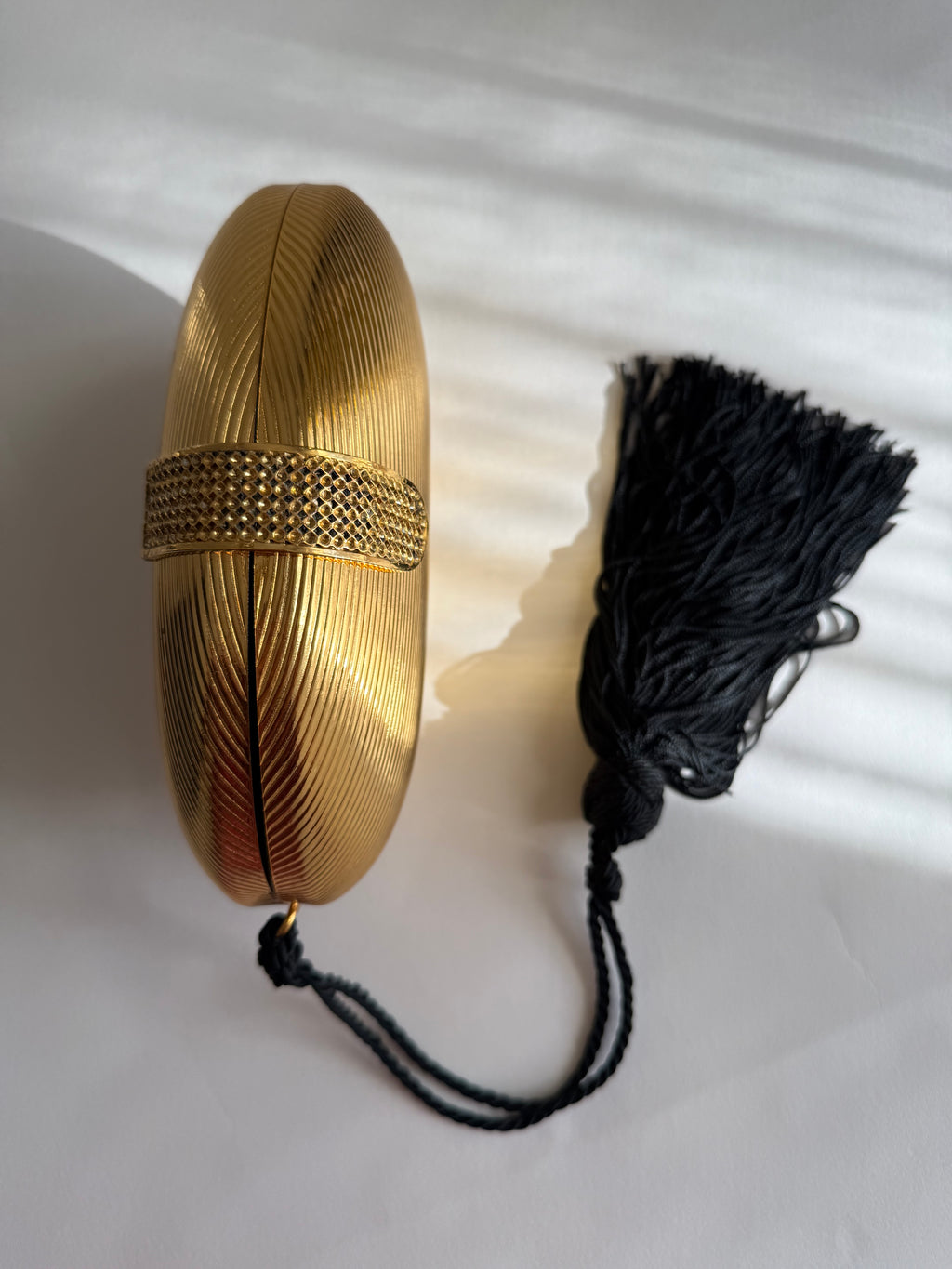 Gold egg shape metal clutch vintage with tassel