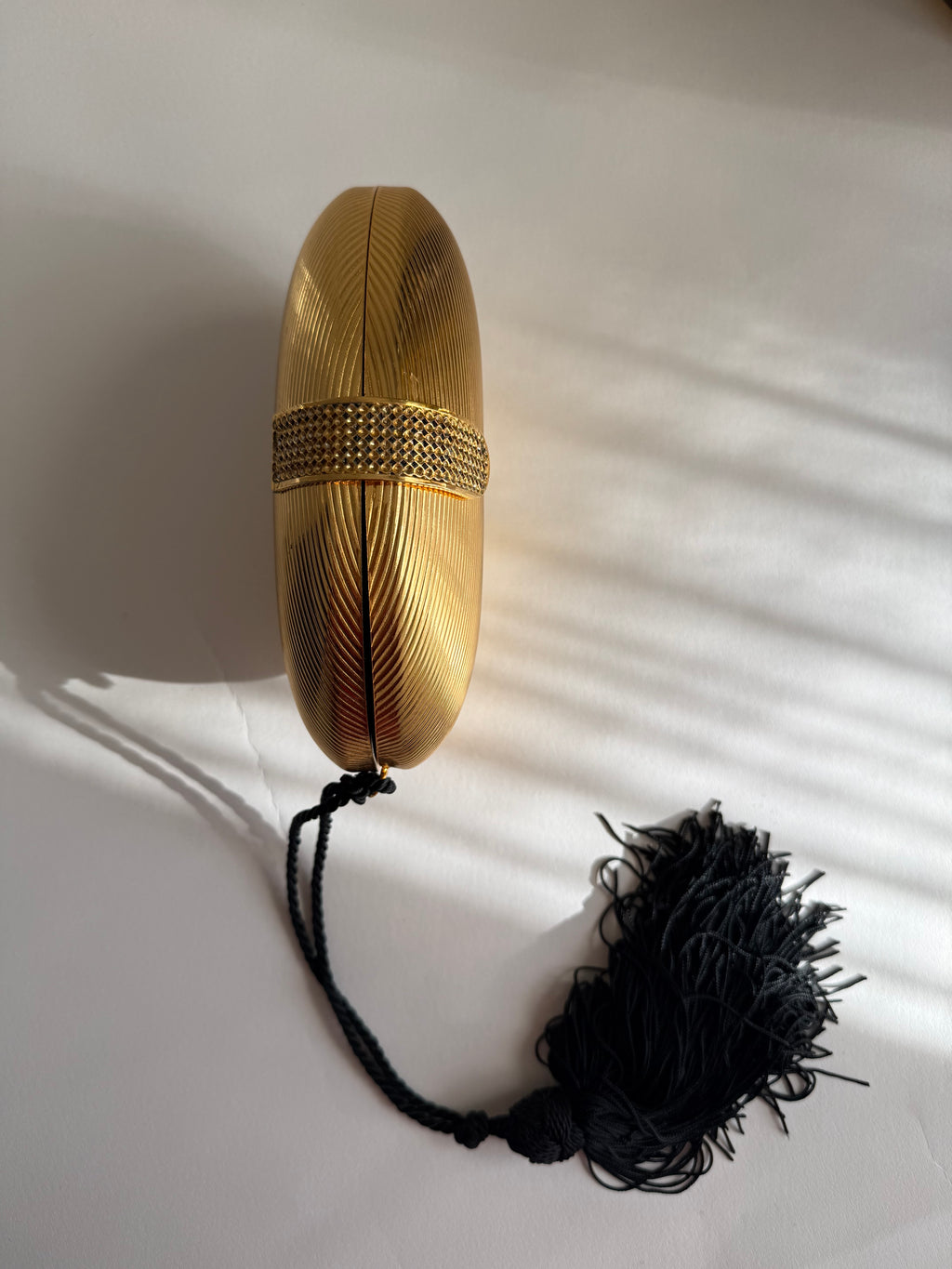 Gold egg shape metal clutch vintage with tassel