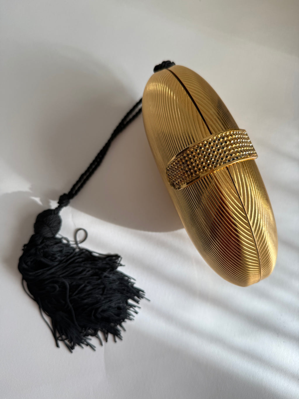 Gold egg shape metal clutch vintage with tassel