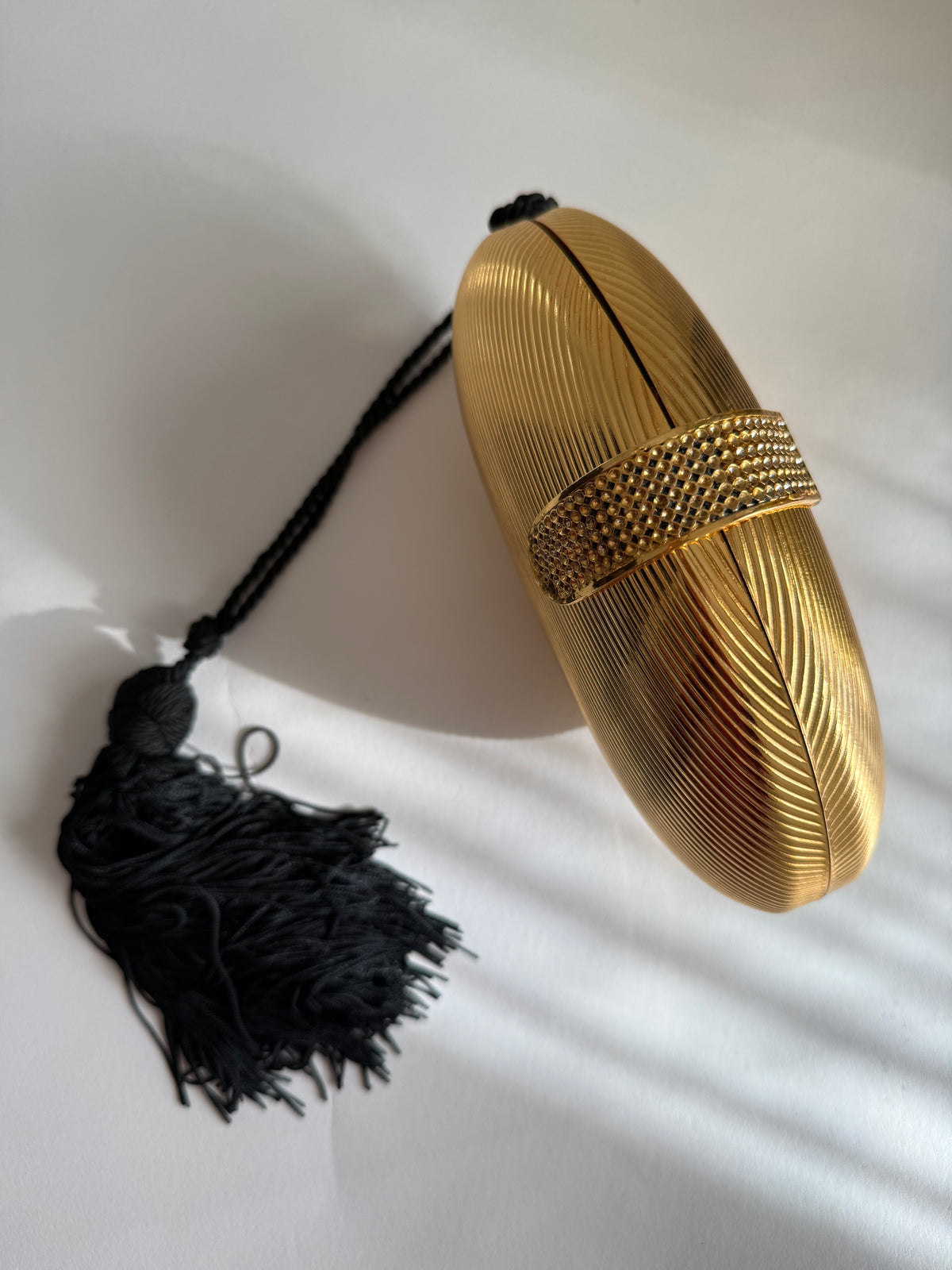Gold egg shape metal clutch vintage with tassel