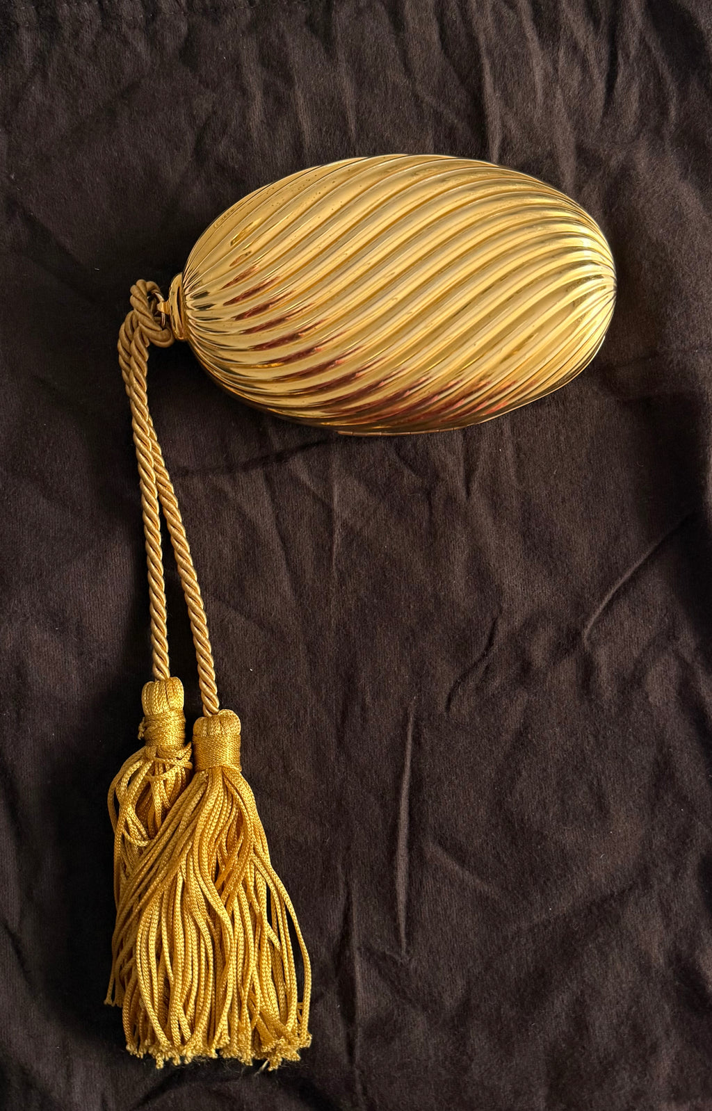 Gold egg metal clutch with tassel "Melone" from 70s