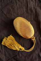Gold egg metal clutch with tassel "Melone" from 70s