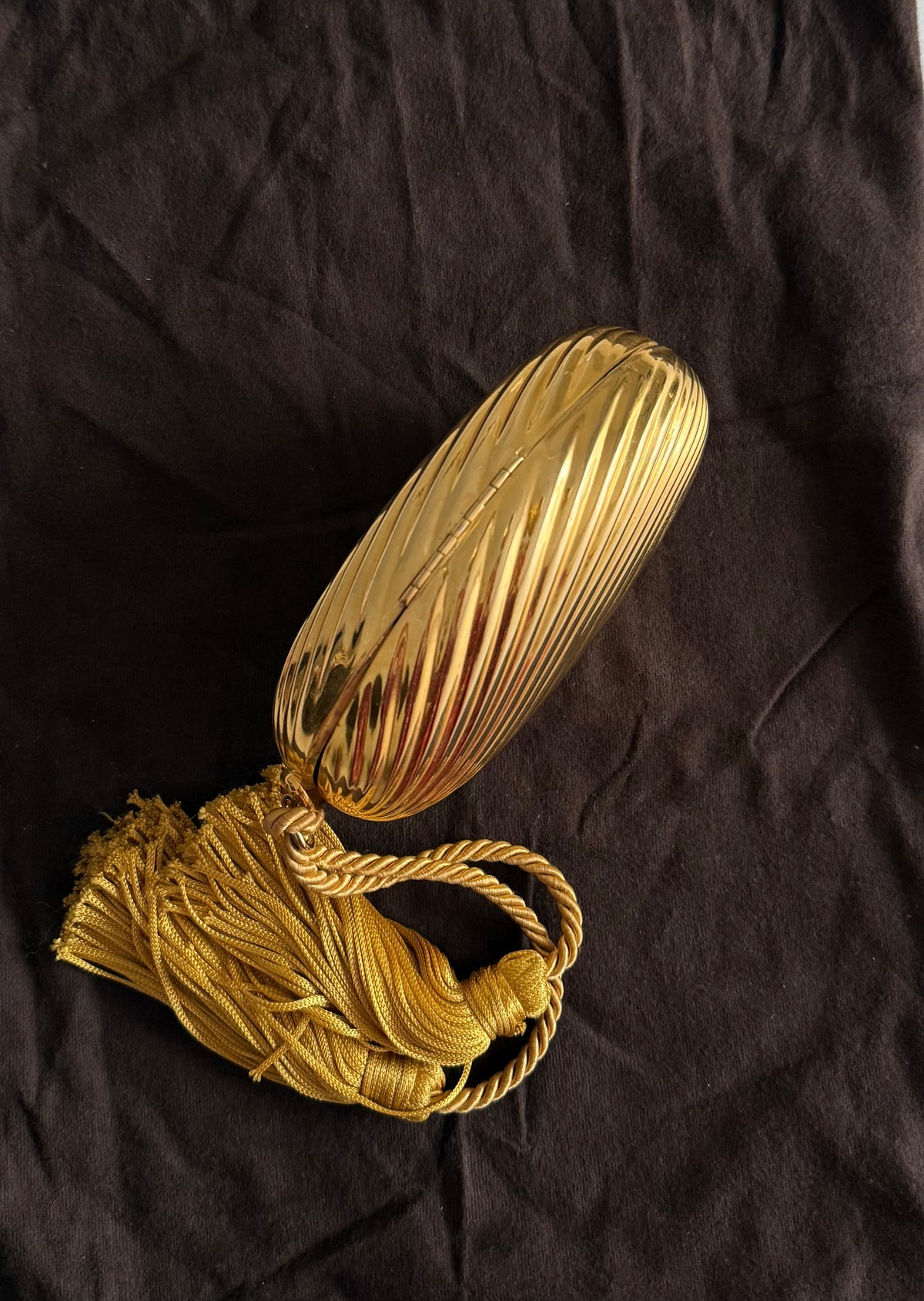 Gold egg metal clutch with tassel "Melone" from 70s