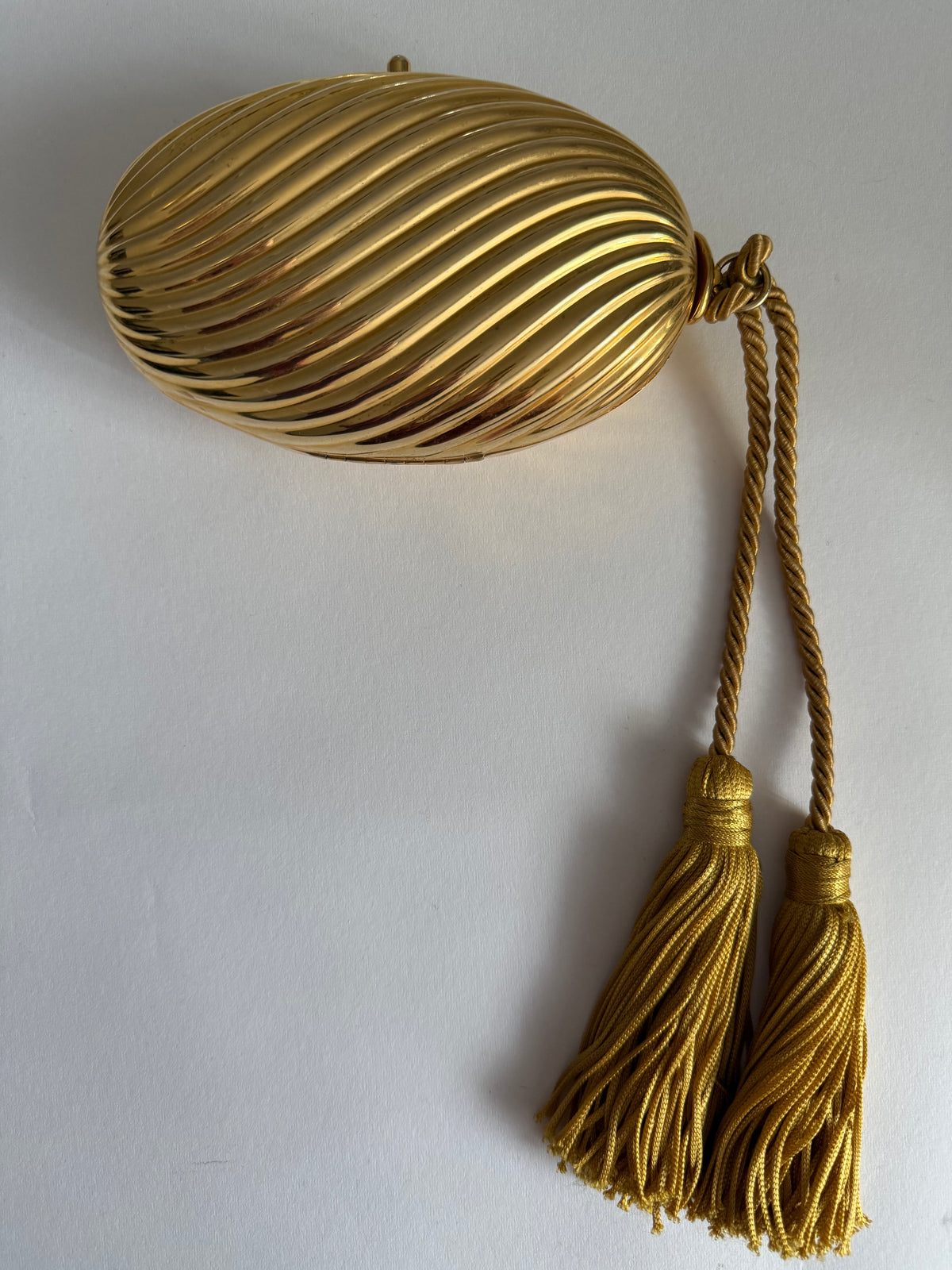 Gold egg metal clutch with tassel "Melone" from 70s