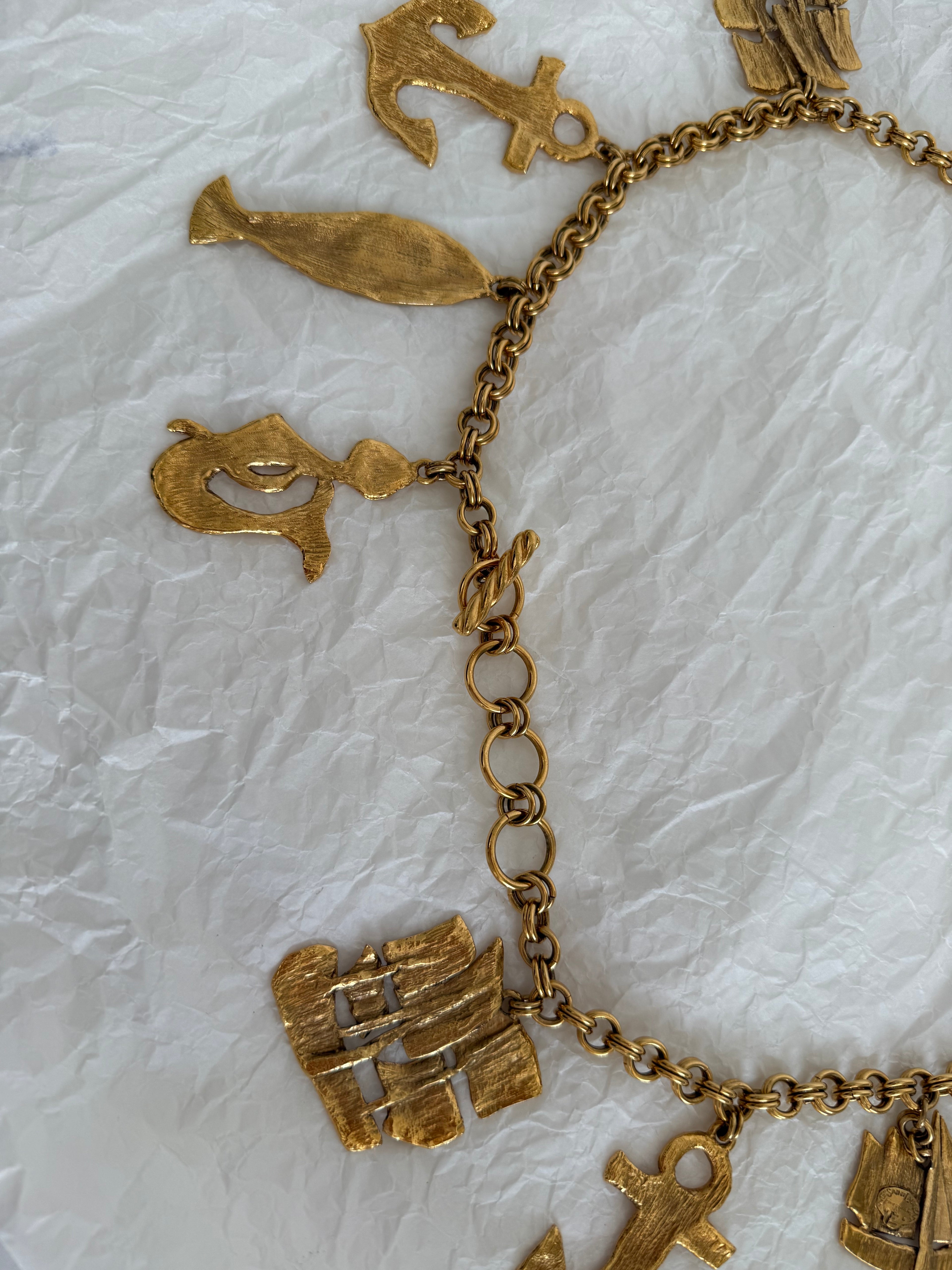 Yves Saint Laurent gold metal belt pendant sea 80s