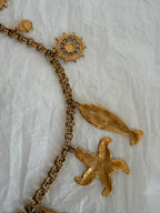 Yves Saint Laurent gold metal belt pendant sea 80s
