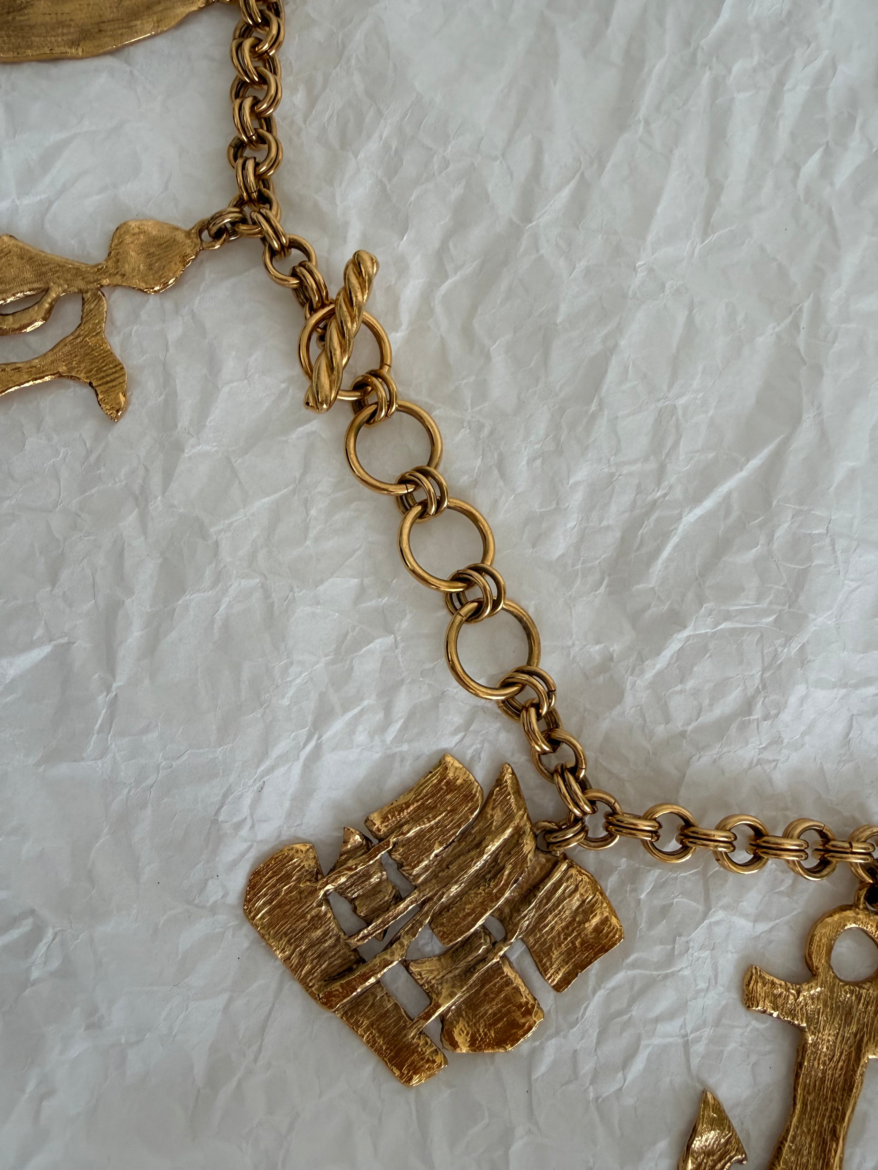 Yves Saint Laurent gold metal belt pendant sea 80s