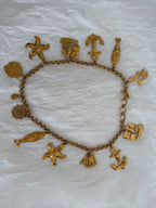 Yves Saint Laurent gold metal belt pendant sea 80s