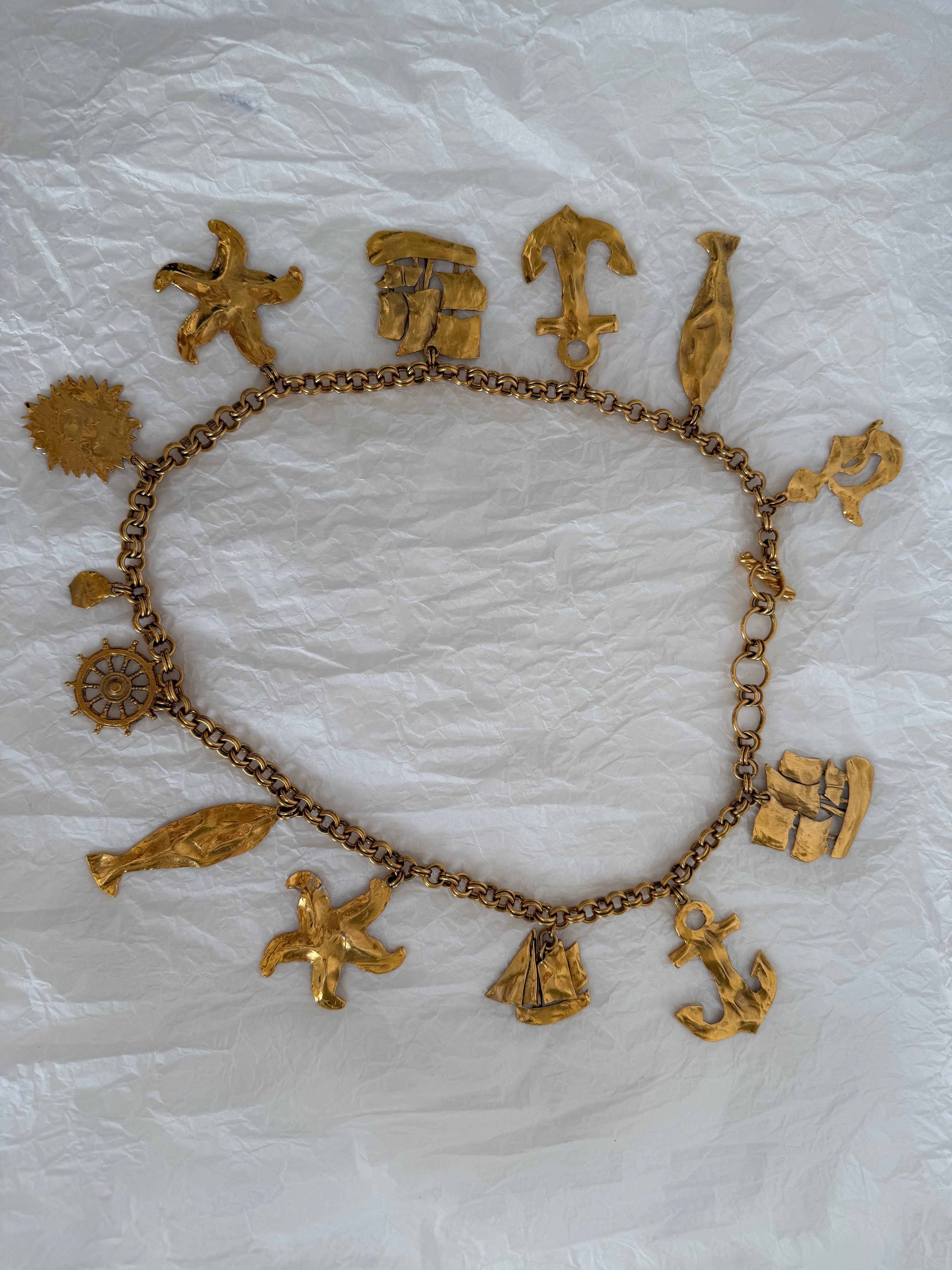 Yves Saint Laurent gold metal belt pendant sea 80s