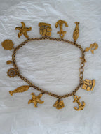 Yves Saint Laurent gold metal belt pendant sea 80s
