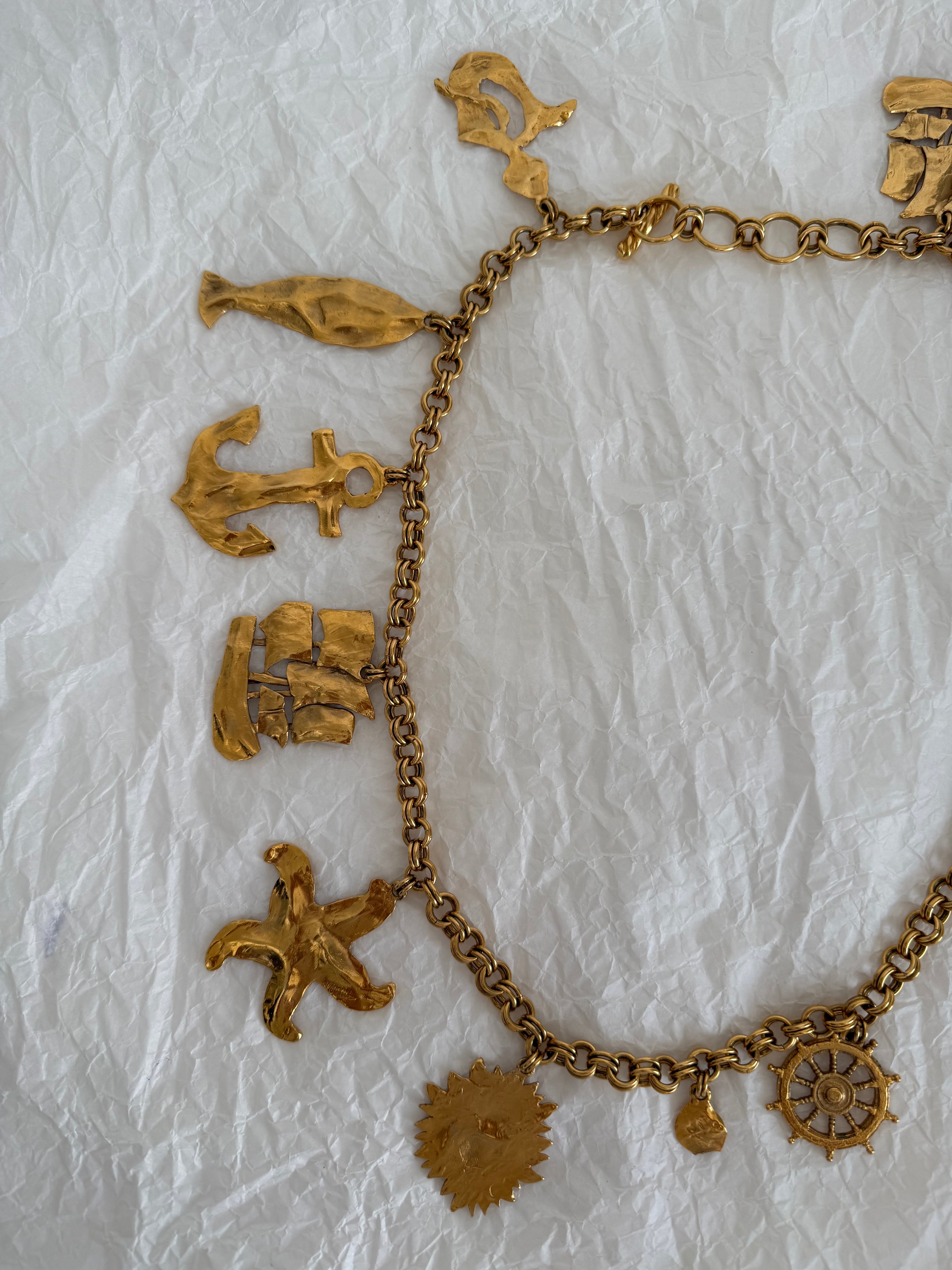 Yves Saint Laurent gold metal belt pendant sea 80s