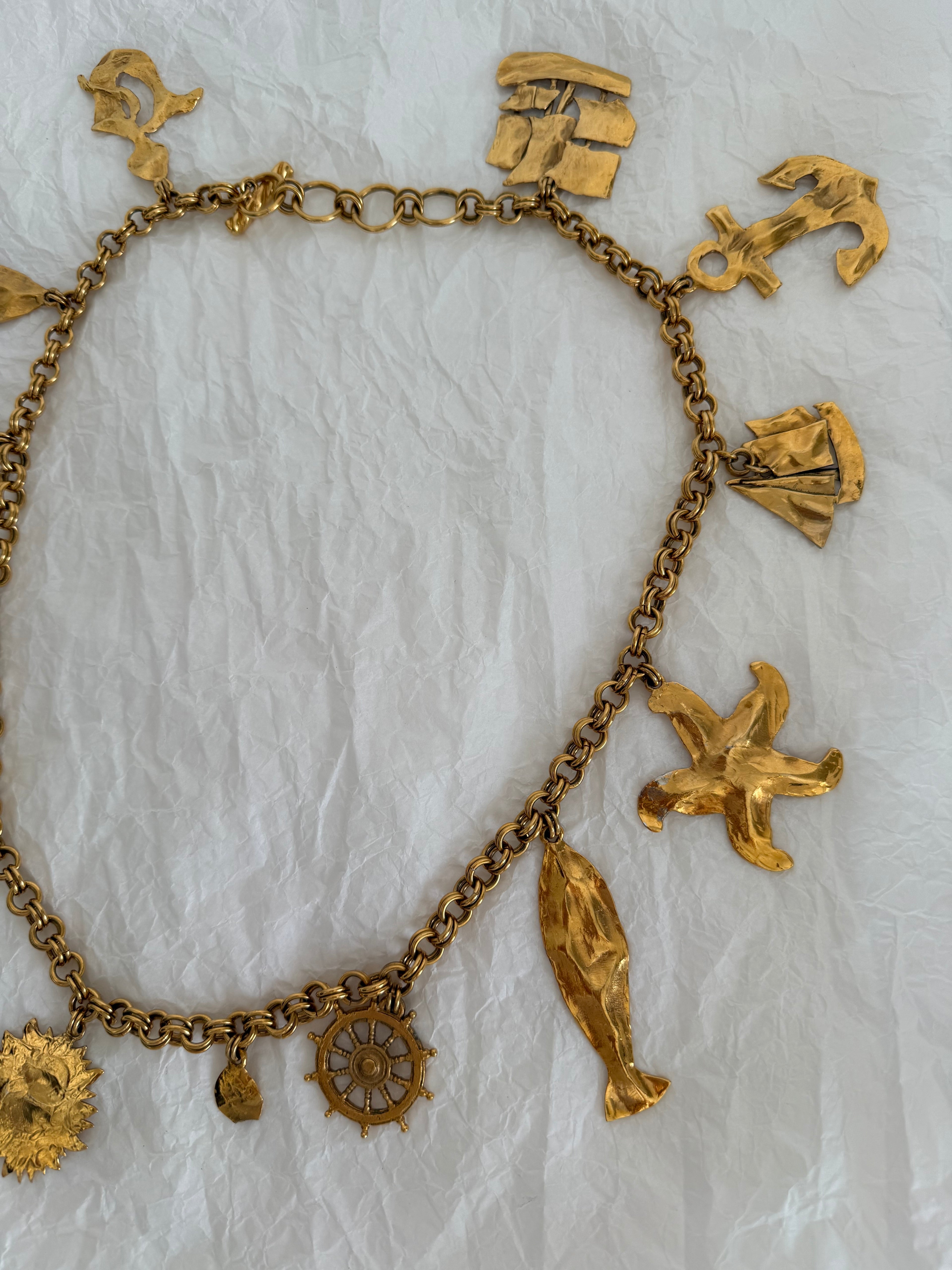 Yves Saint Laurent gold metal belt pendant sea 80s