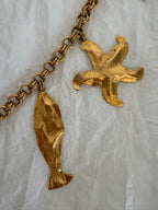 Yves Saint Laurent gold metal belt pendant sea 80s