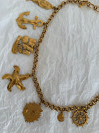Yves Saint Laurent gold metal belt pendant sea 80s