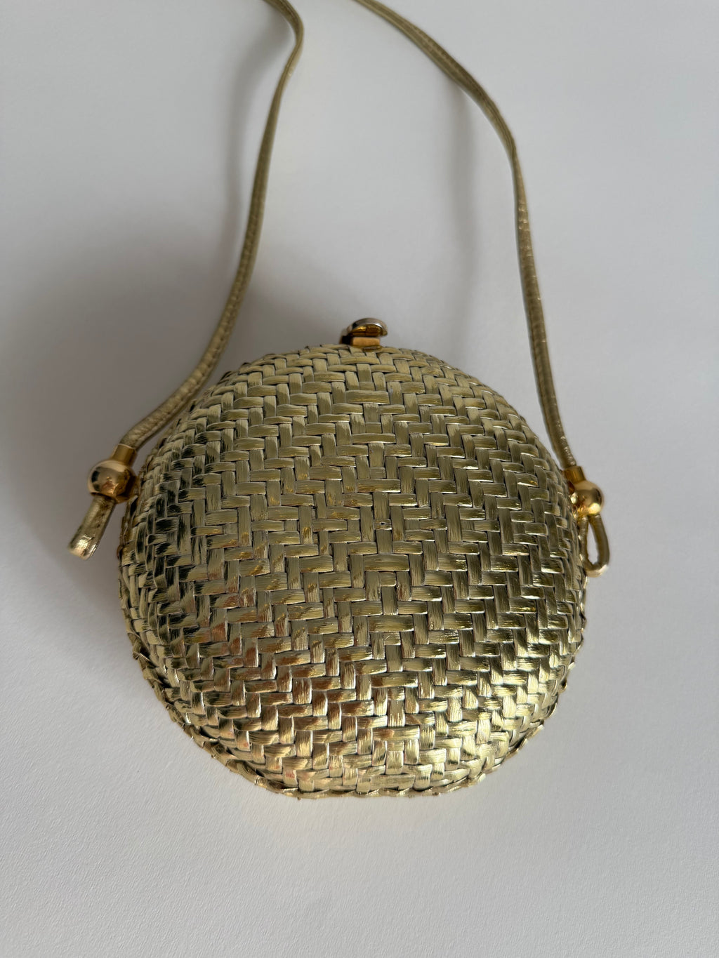 Rodo gold clutch wicker bag