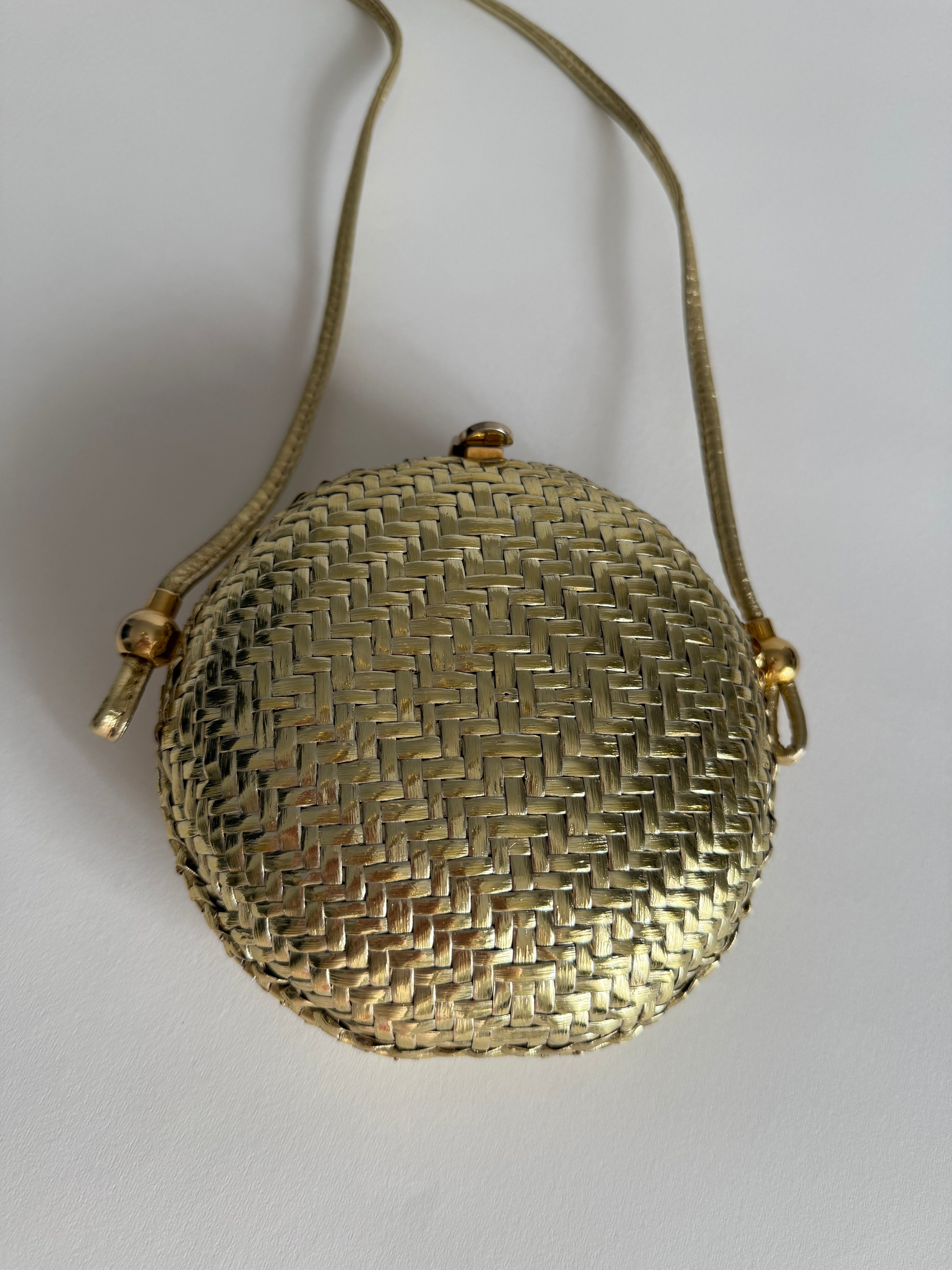 Rodo gold clutch wicker bag
