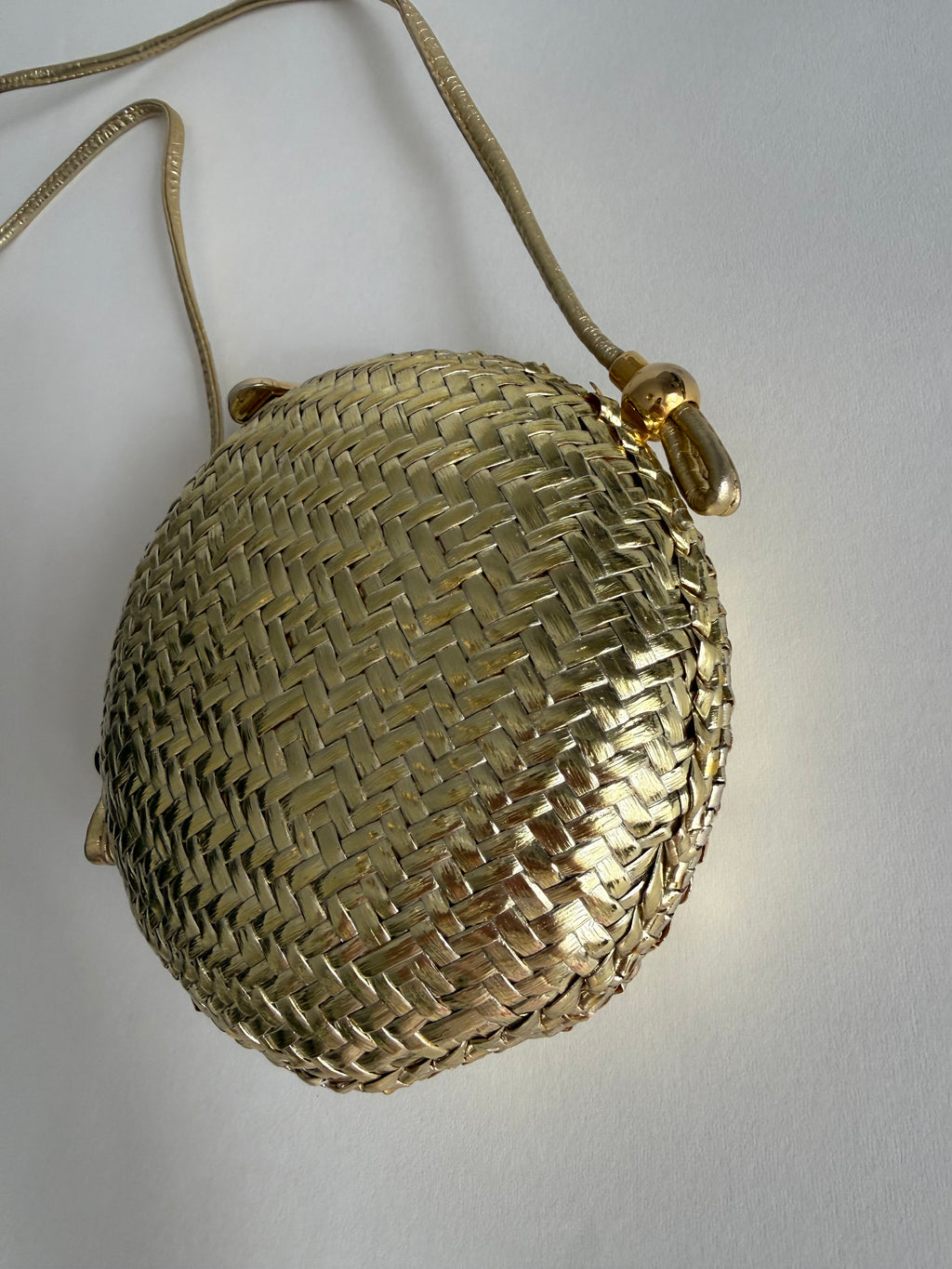Rodo gold clutch wicker bag