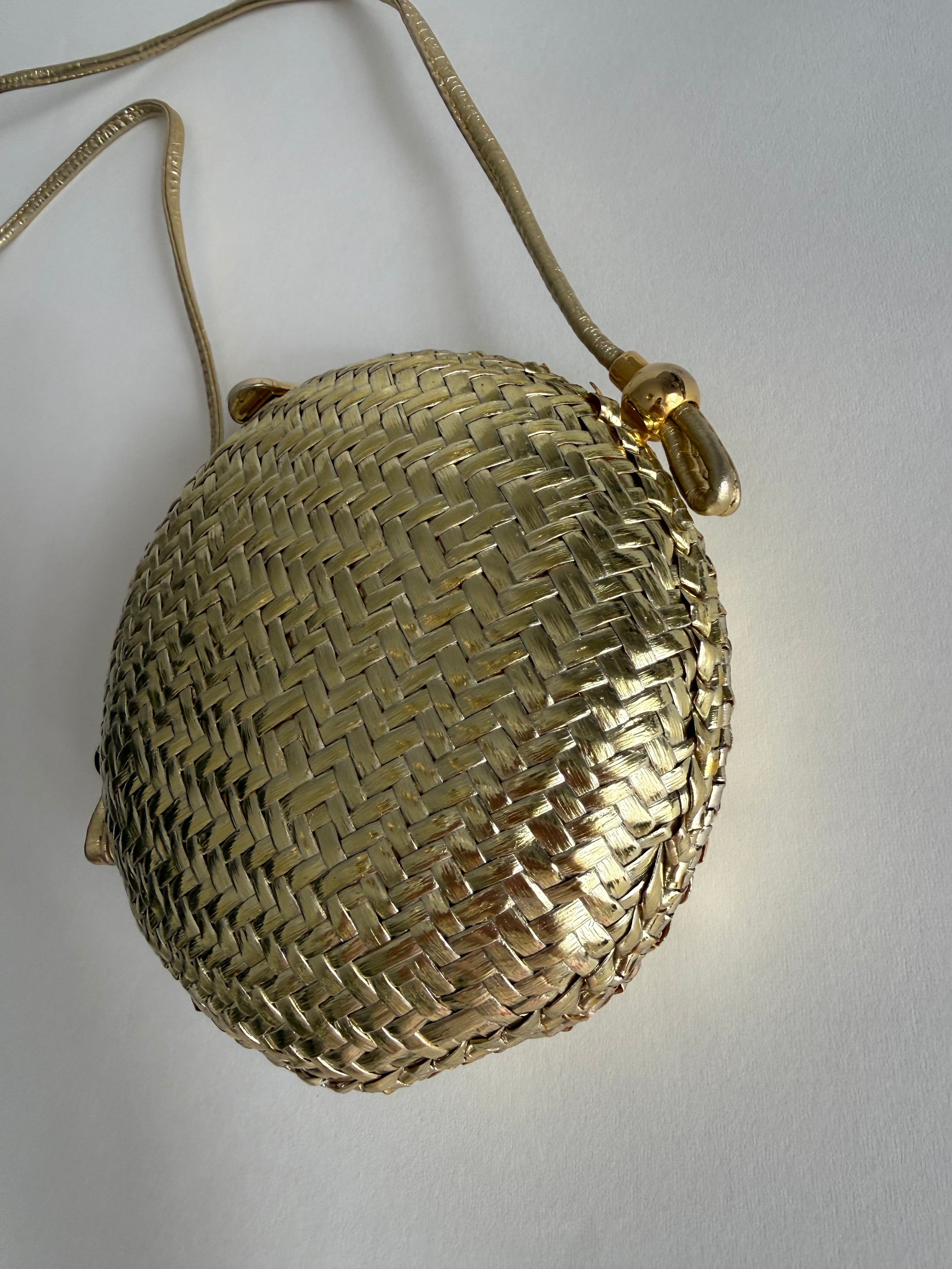 Rodo gold clutch wicker bag