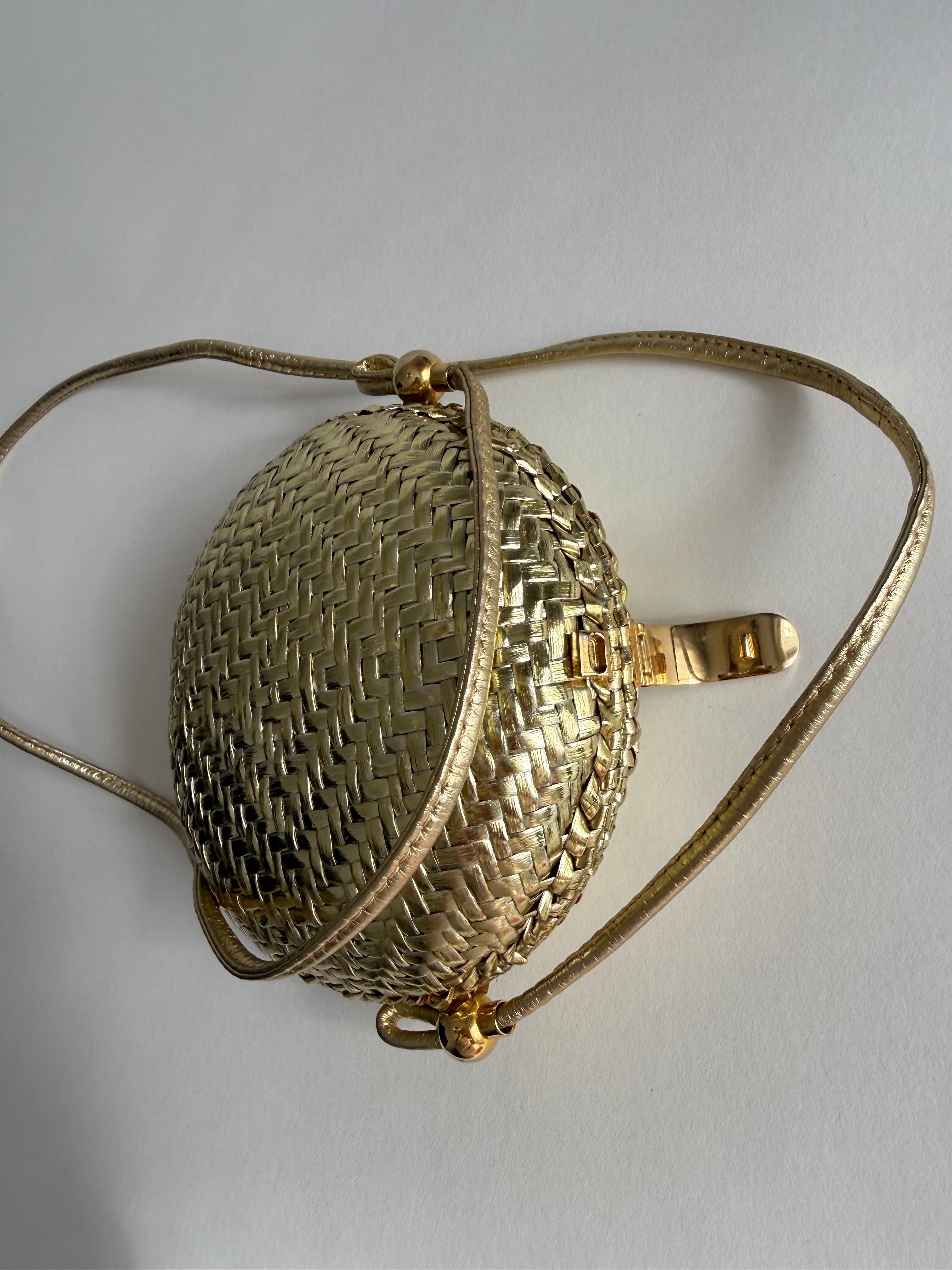Rodo gold clutch wicker bag