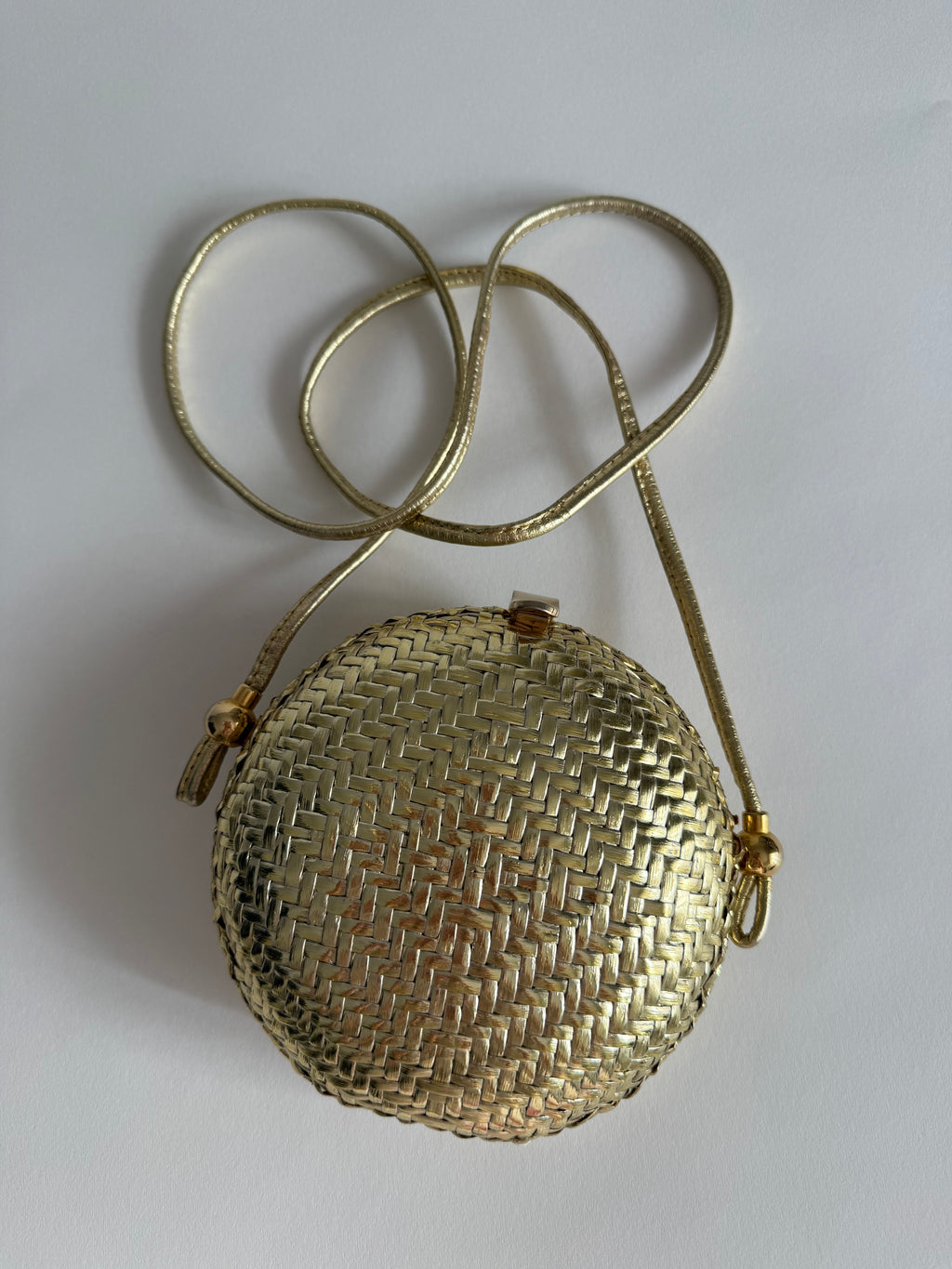Rodo gold clutch wicker bag