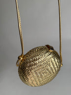 Rodo gold clutch wicker bag