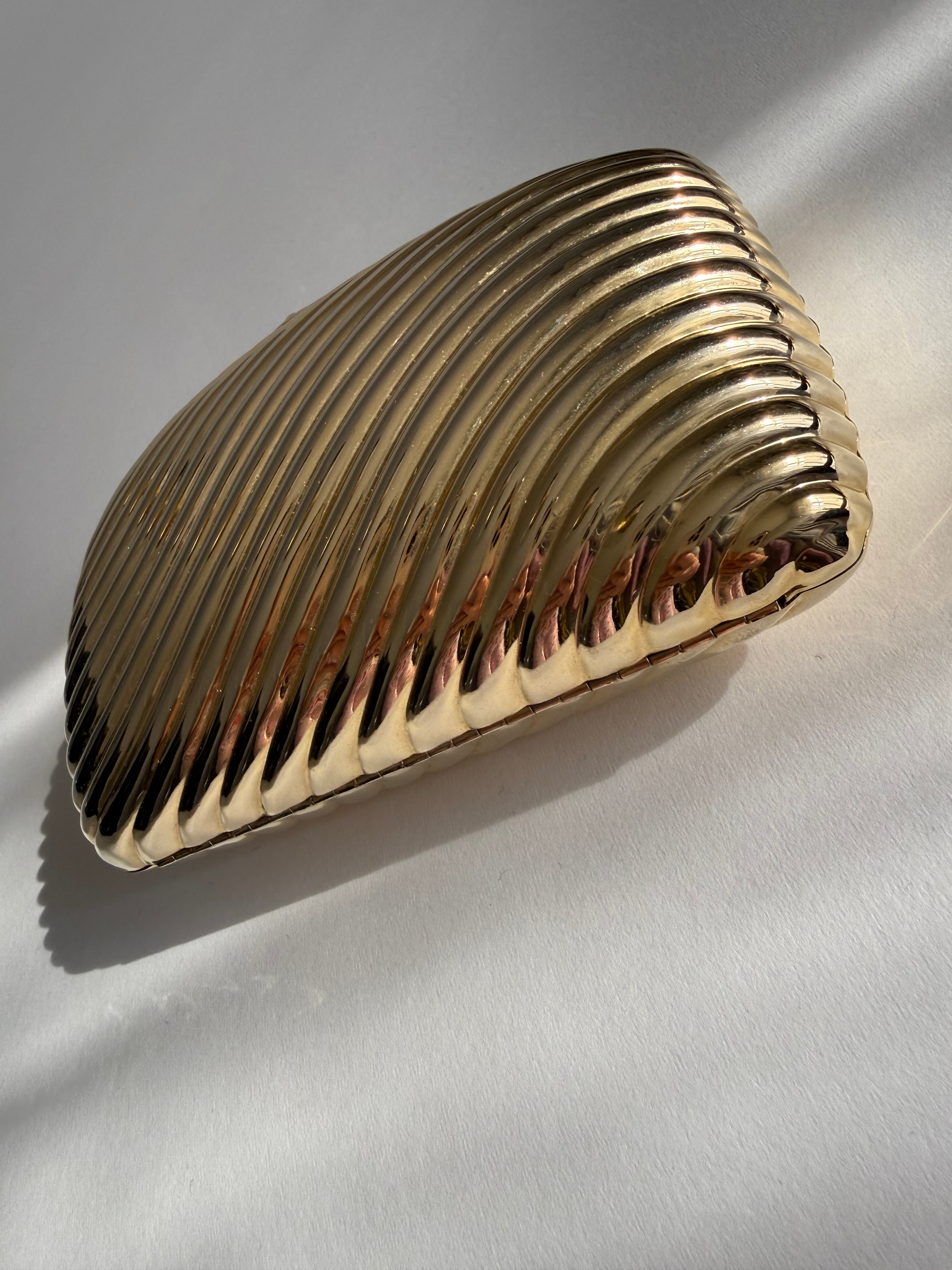 Gold clutch metal Vogini Venice