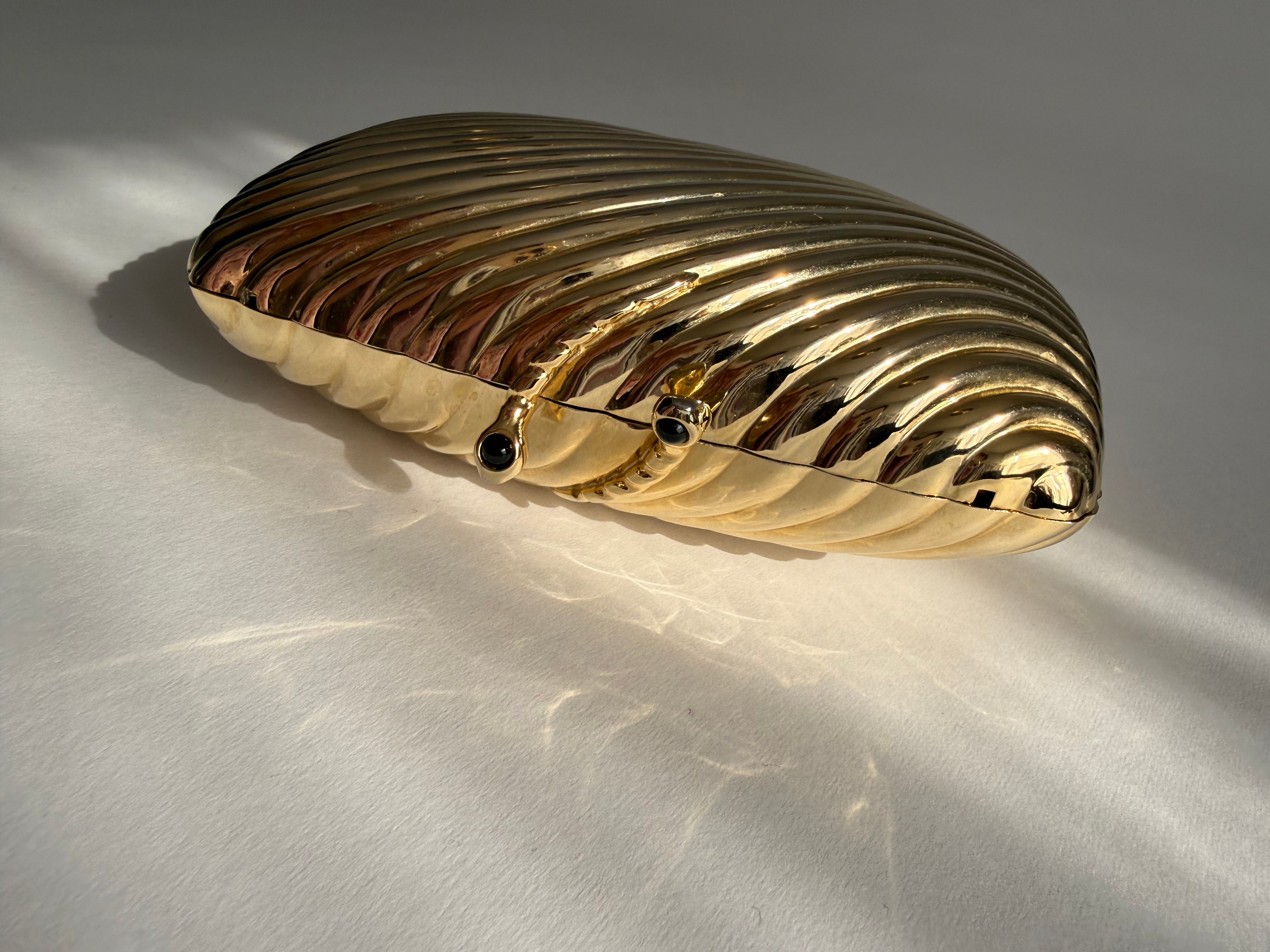 Gold clutch metal Vogini Venice