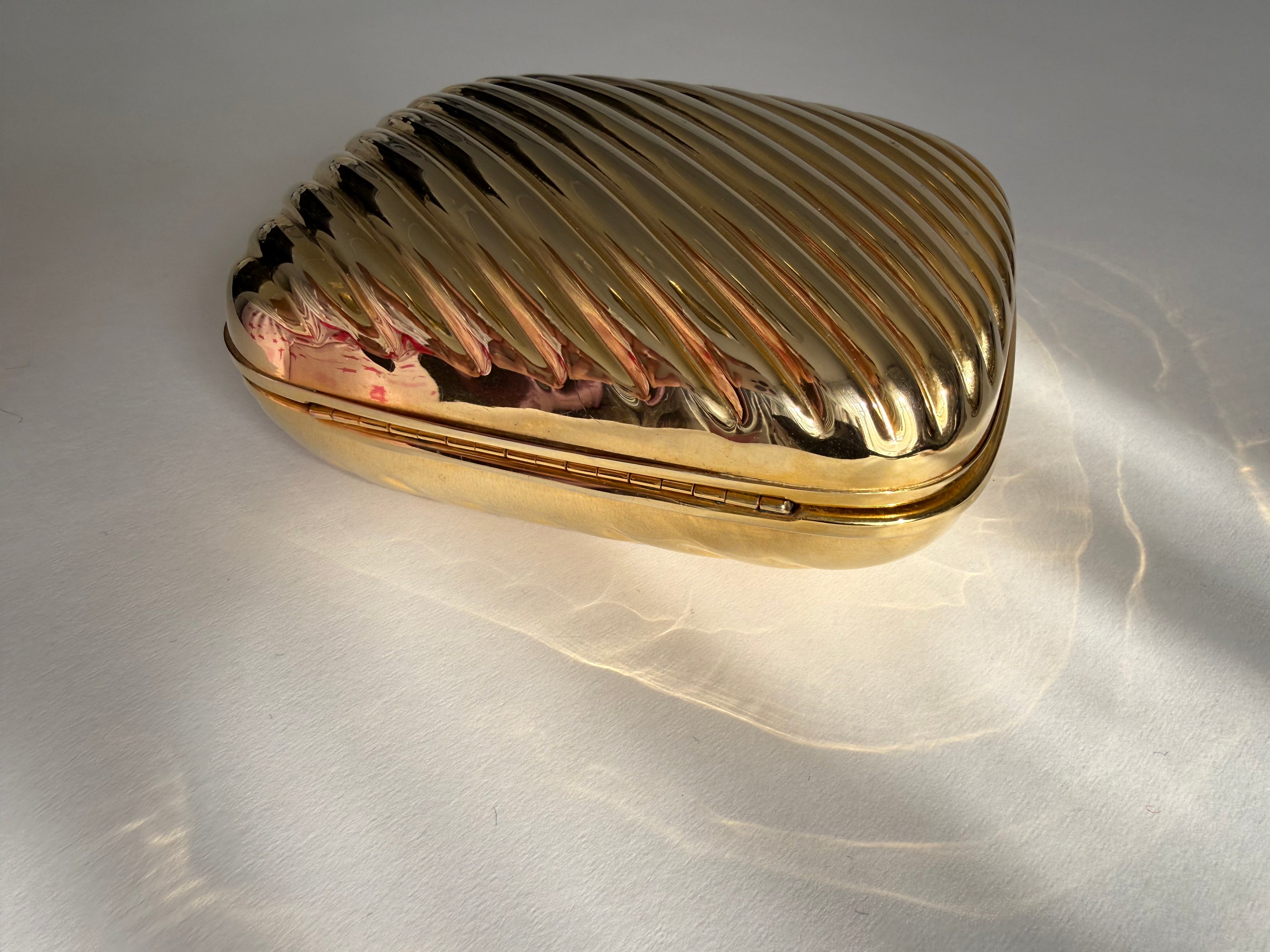 Gold metal clutch