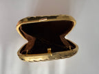 Gold metal clutch