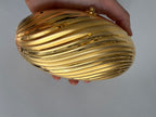 Gold clutch egg 80s