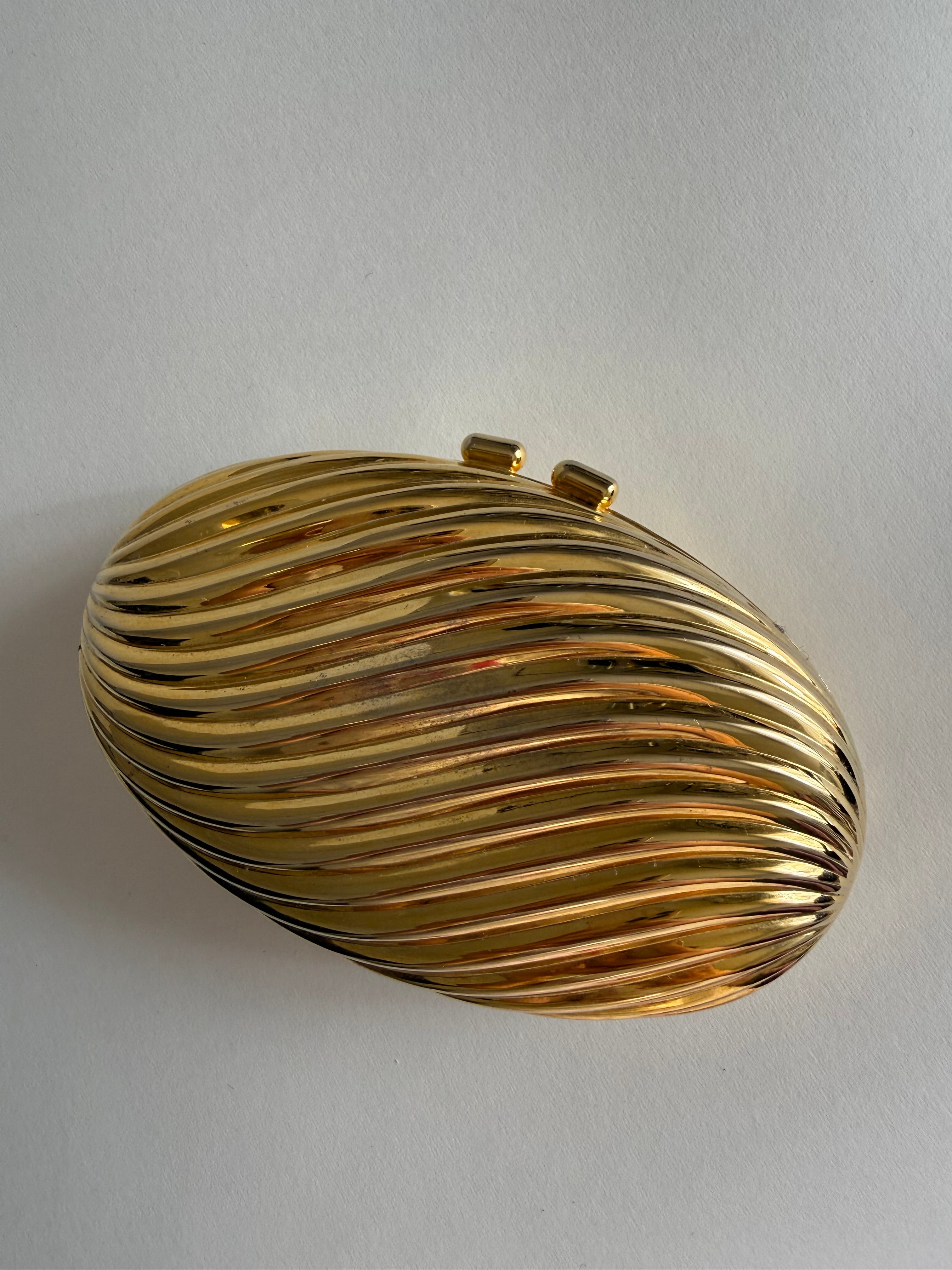 Gold clutch egg tassel