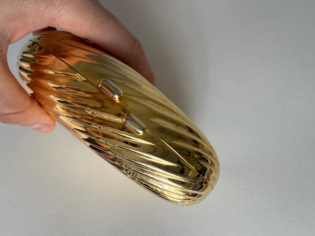 Gold clutch egg tassel