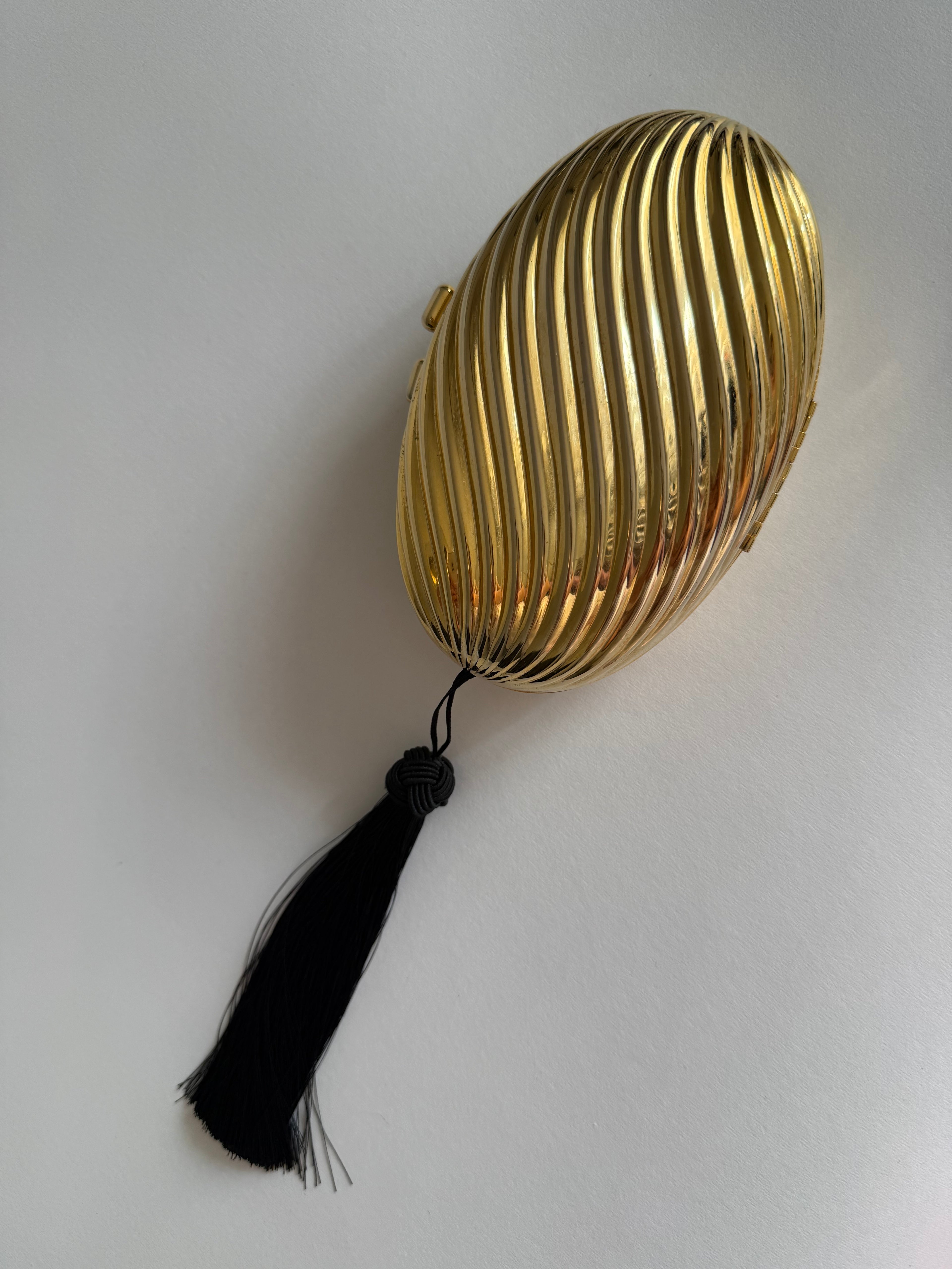 Gold clutch egg tassel