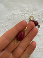 Red earrings pendant with golden four-leaf clover