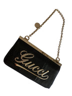 Gucci satin and snake leather pochette